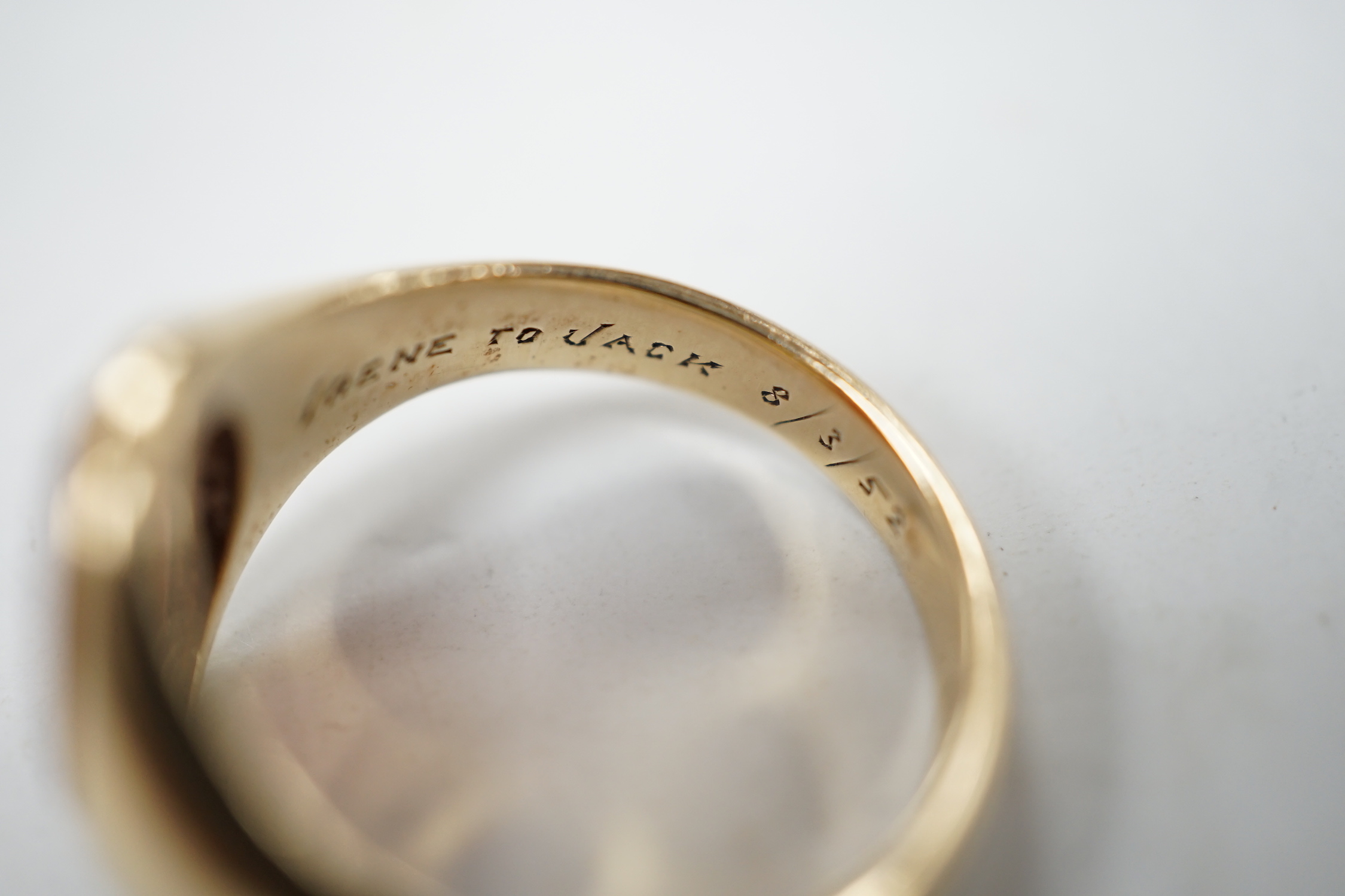 A 1930's 9ct gold and carnelian set oval signet ring, size Q, gross weight 5.7 grams.